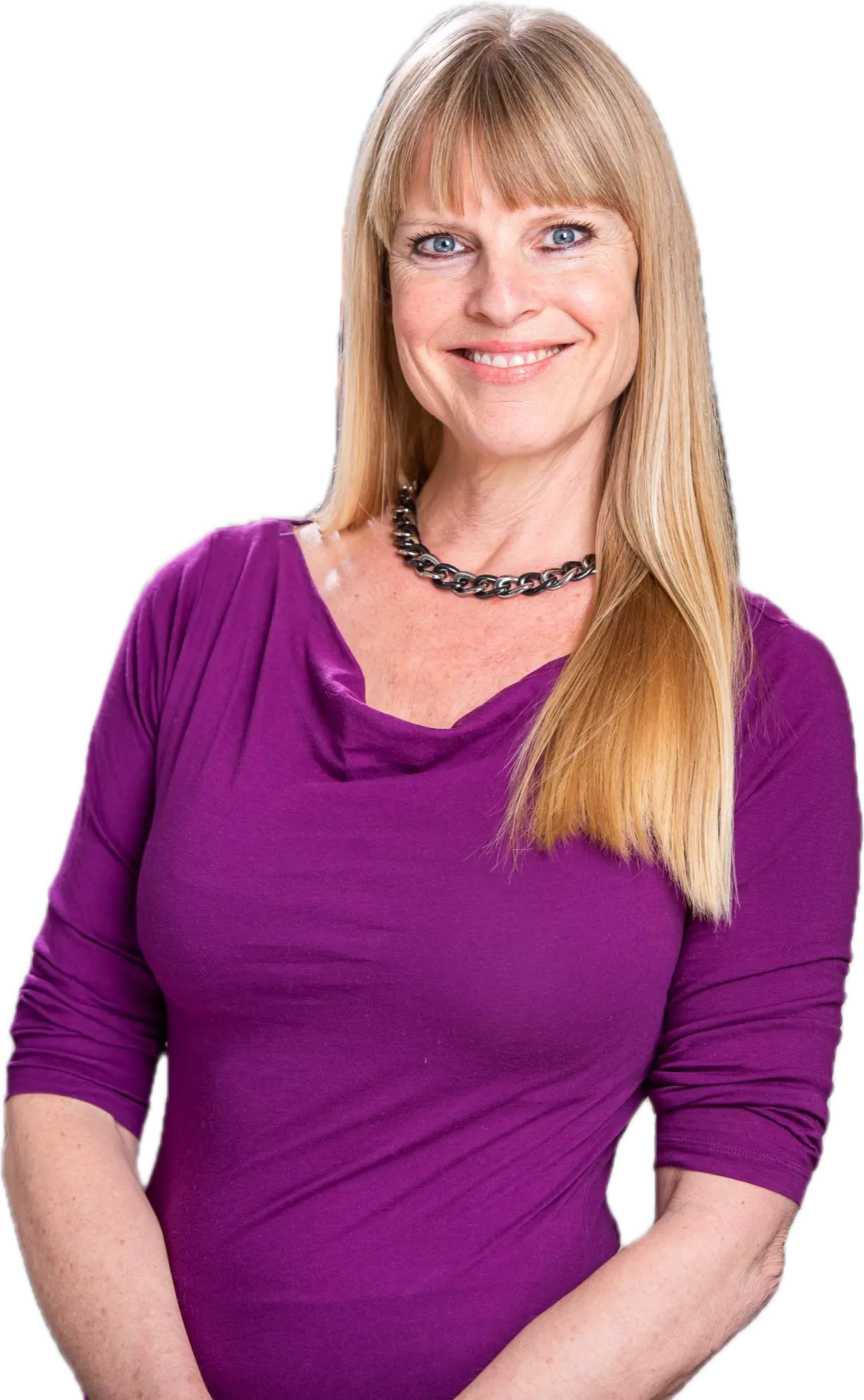 Deanna Hansen smiling, wearing a magenta top