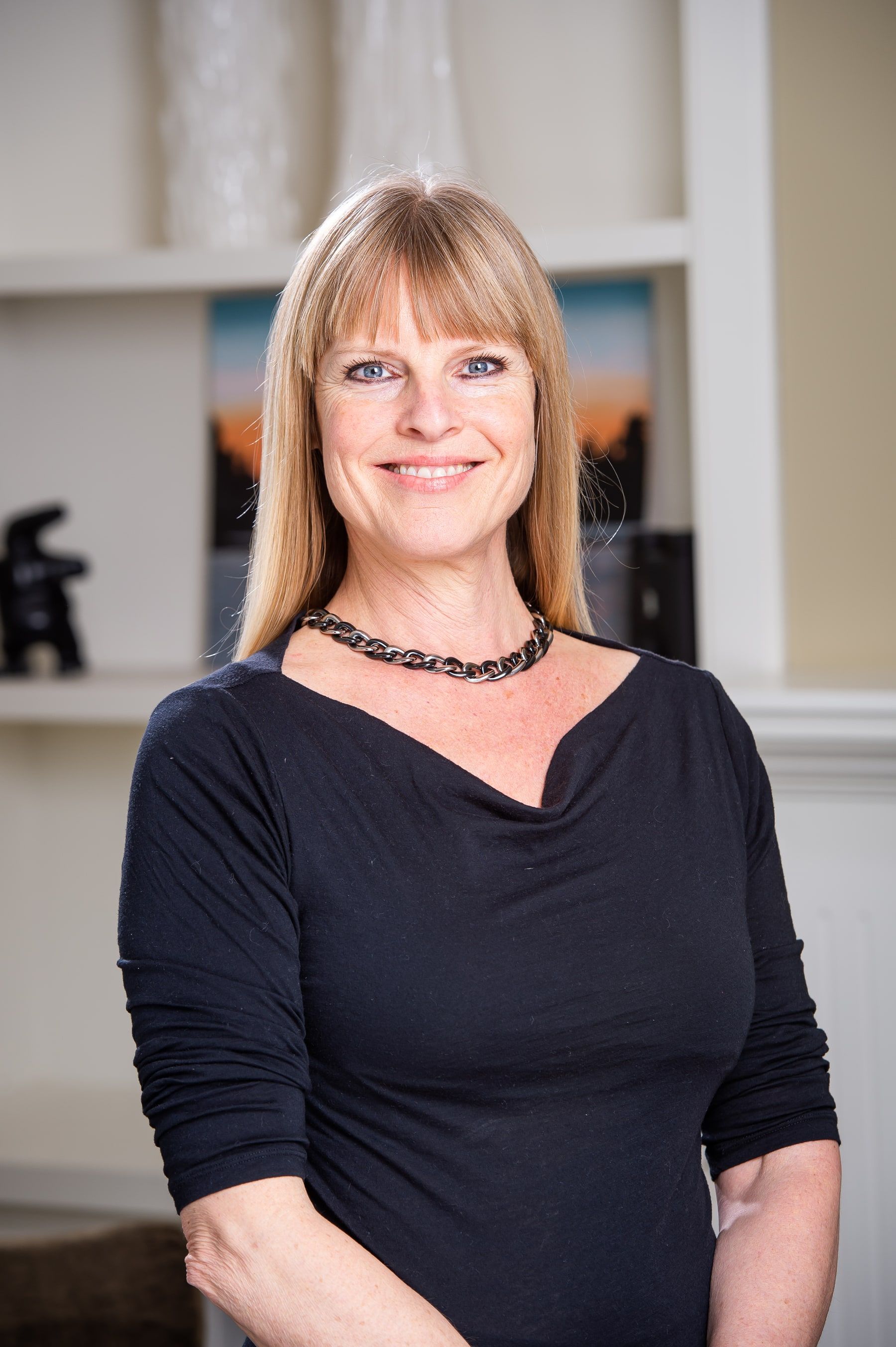 Deanna Hansen in a black top, smiling